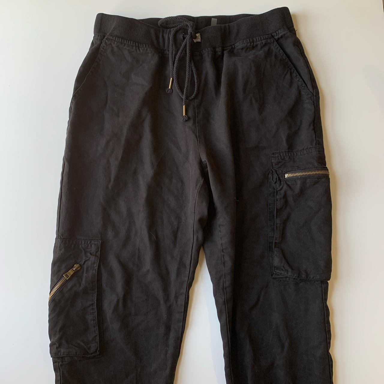 Black cargo type pants Cuffed ankles Large pockets... Depop