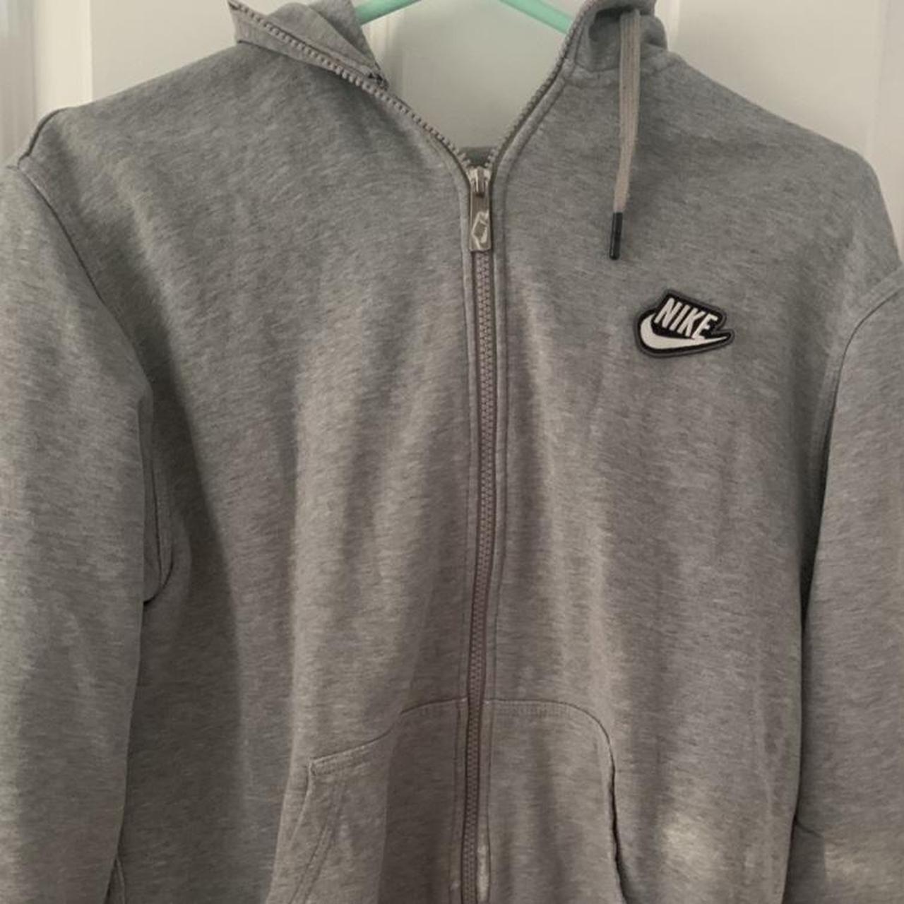 grey nike zip up hoddie. small holes in arms but... - Depop