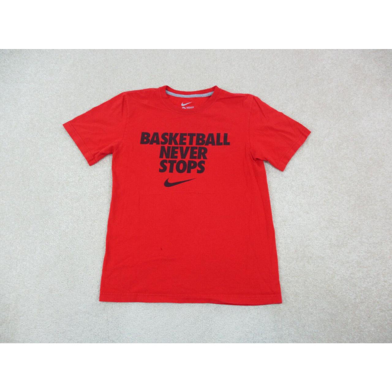 red nike shirt with black swoosh