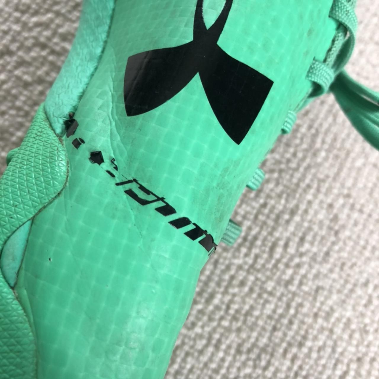 Lime green under armour hotsell football cleats