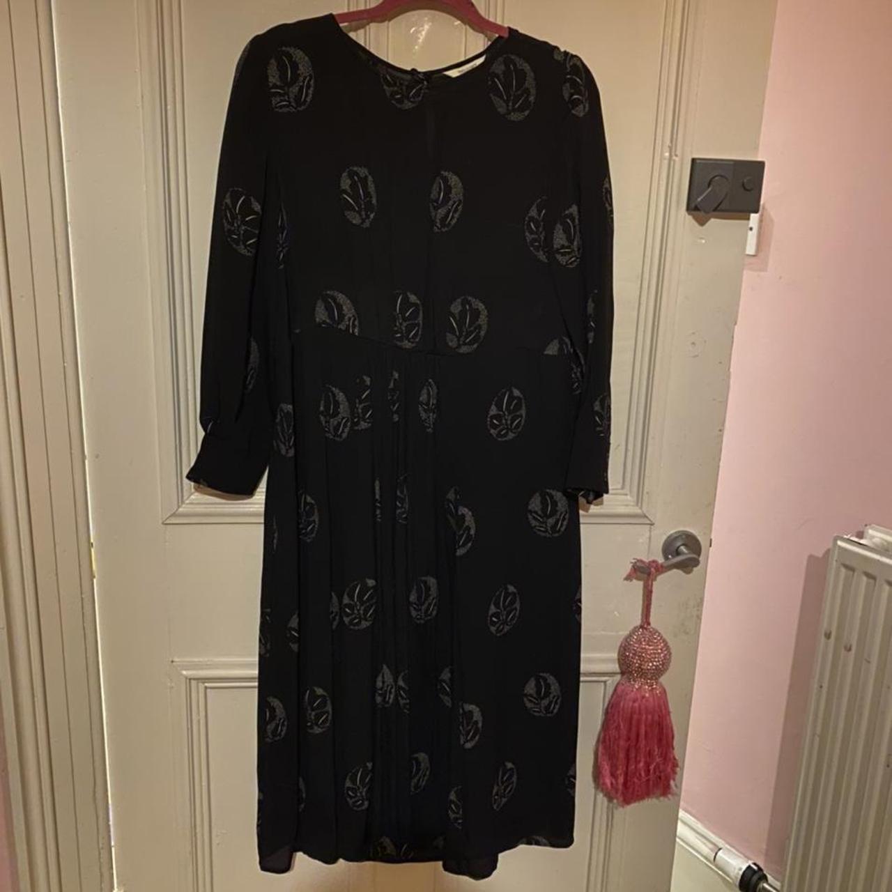Toast dress with a lovely print. Has tear to back of... Depop