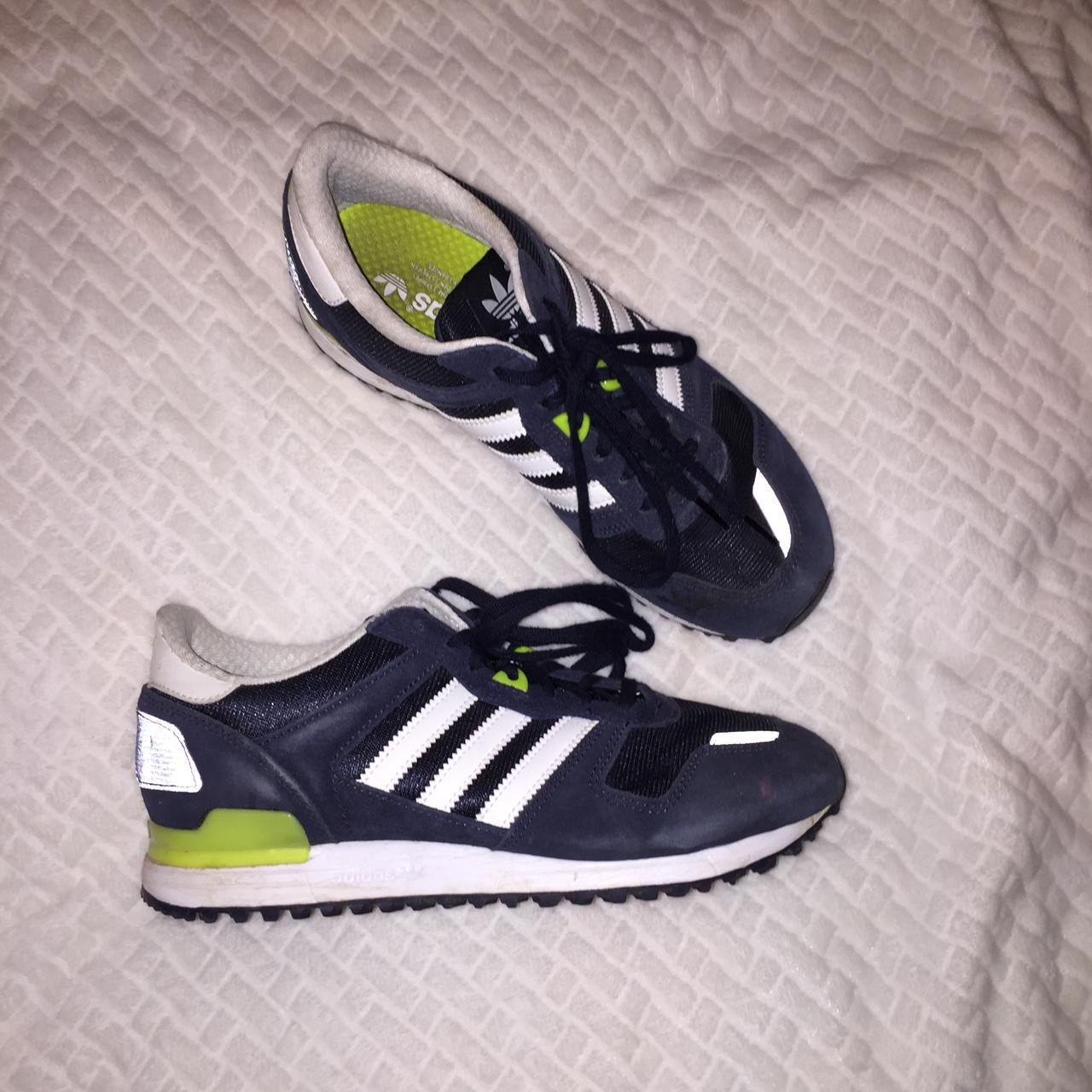 Navy blue Adidas with lime green detailing. Well
