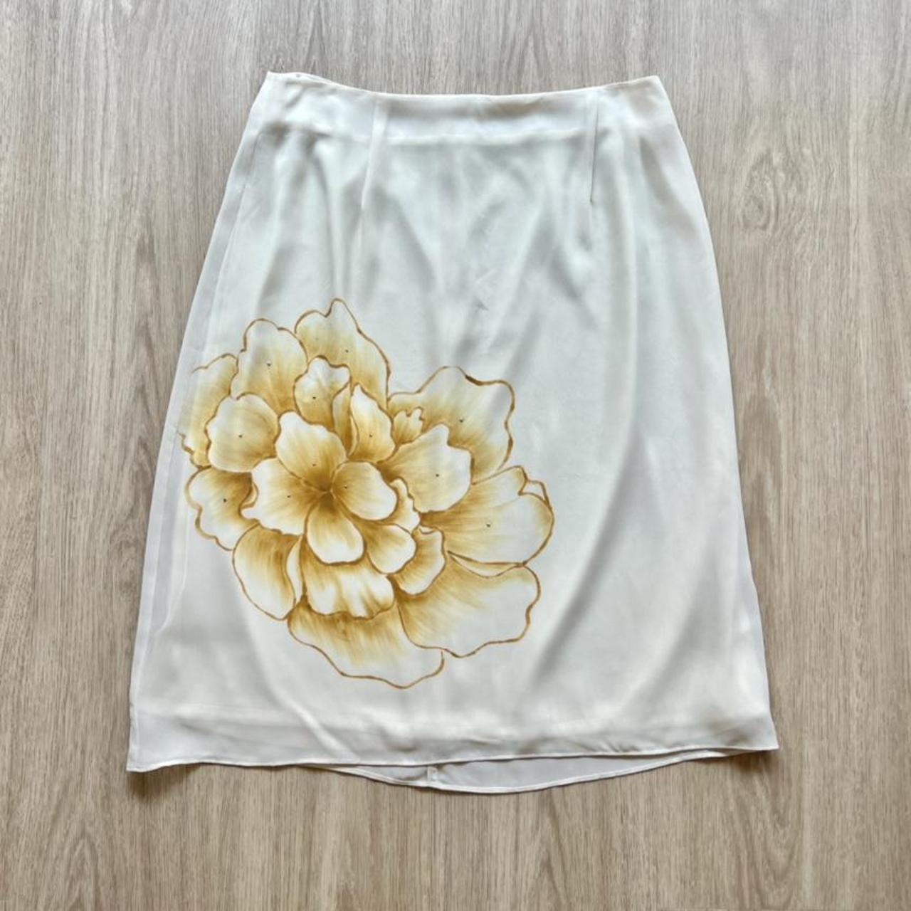 White skirt with outlet yellow flowers