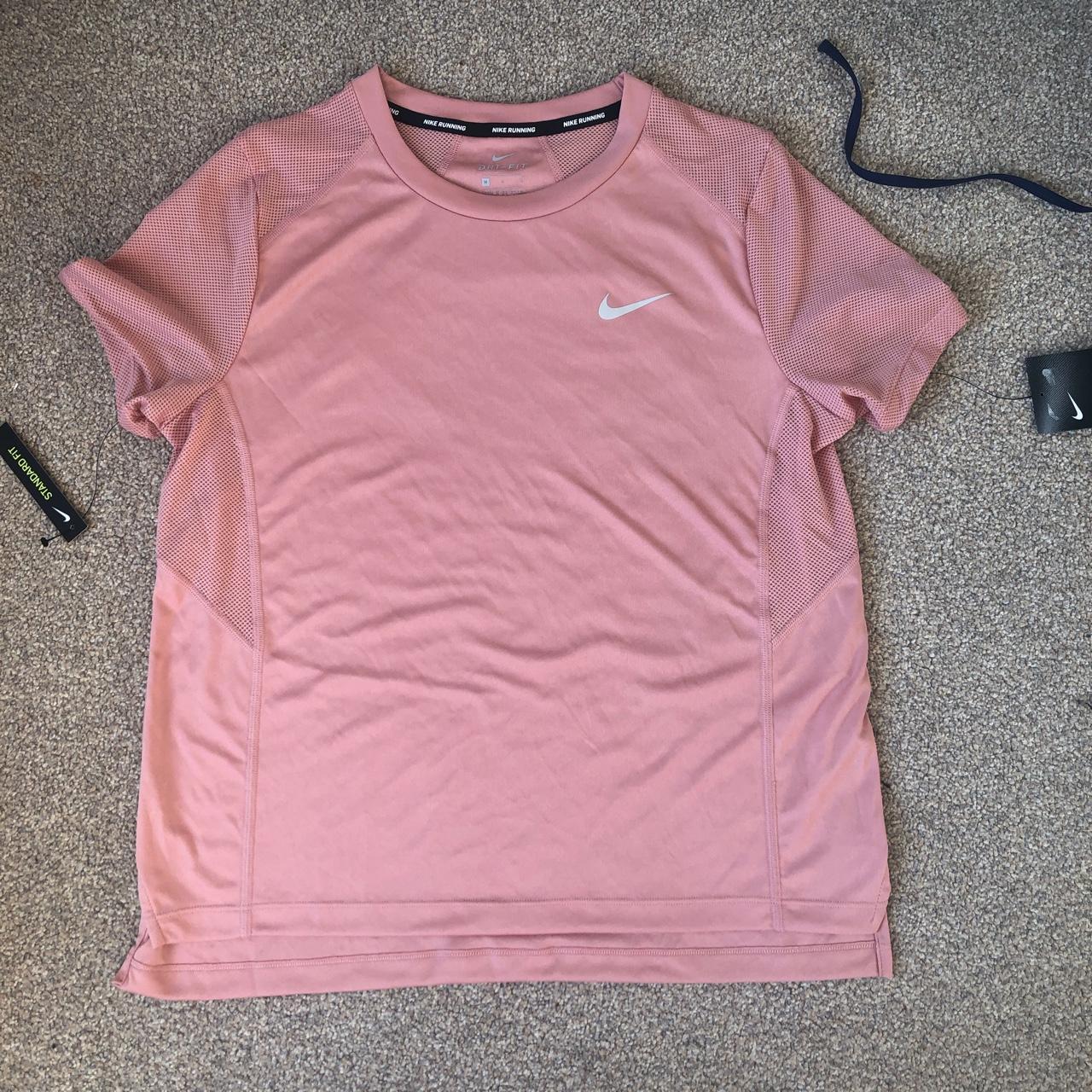 Nike Dri-Fit pink short sleeve t-shirt. Never worn... - Depop