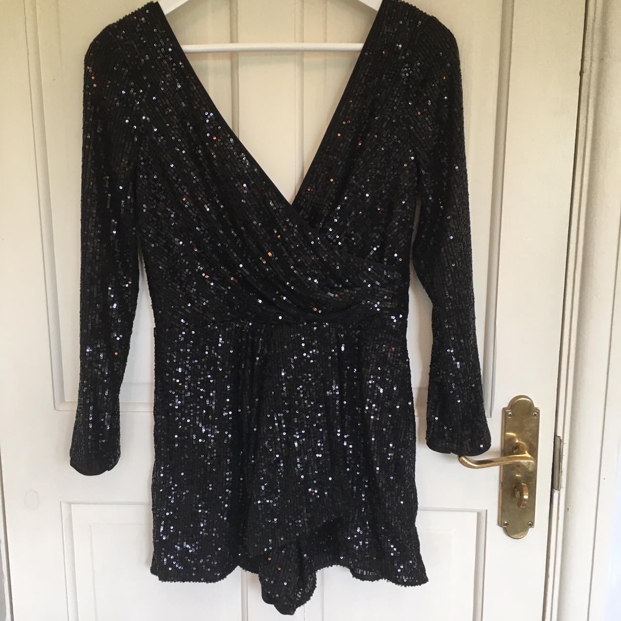 Sequinned black playsuit with long sleeves and wrap... - Depop