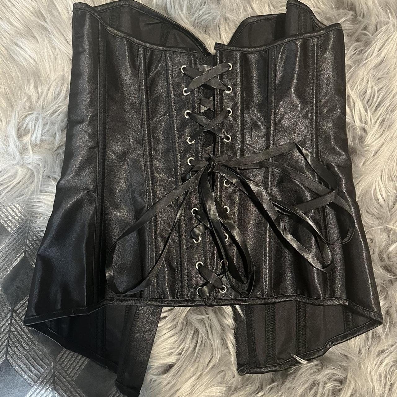 Black satin corset in size XS. Never worn.... - Depop