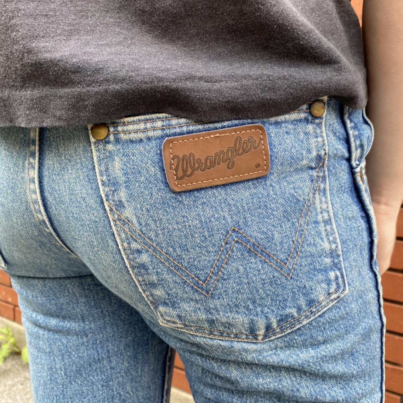 Medium wash slim wrangler jeans with a modified hem.... - Depop