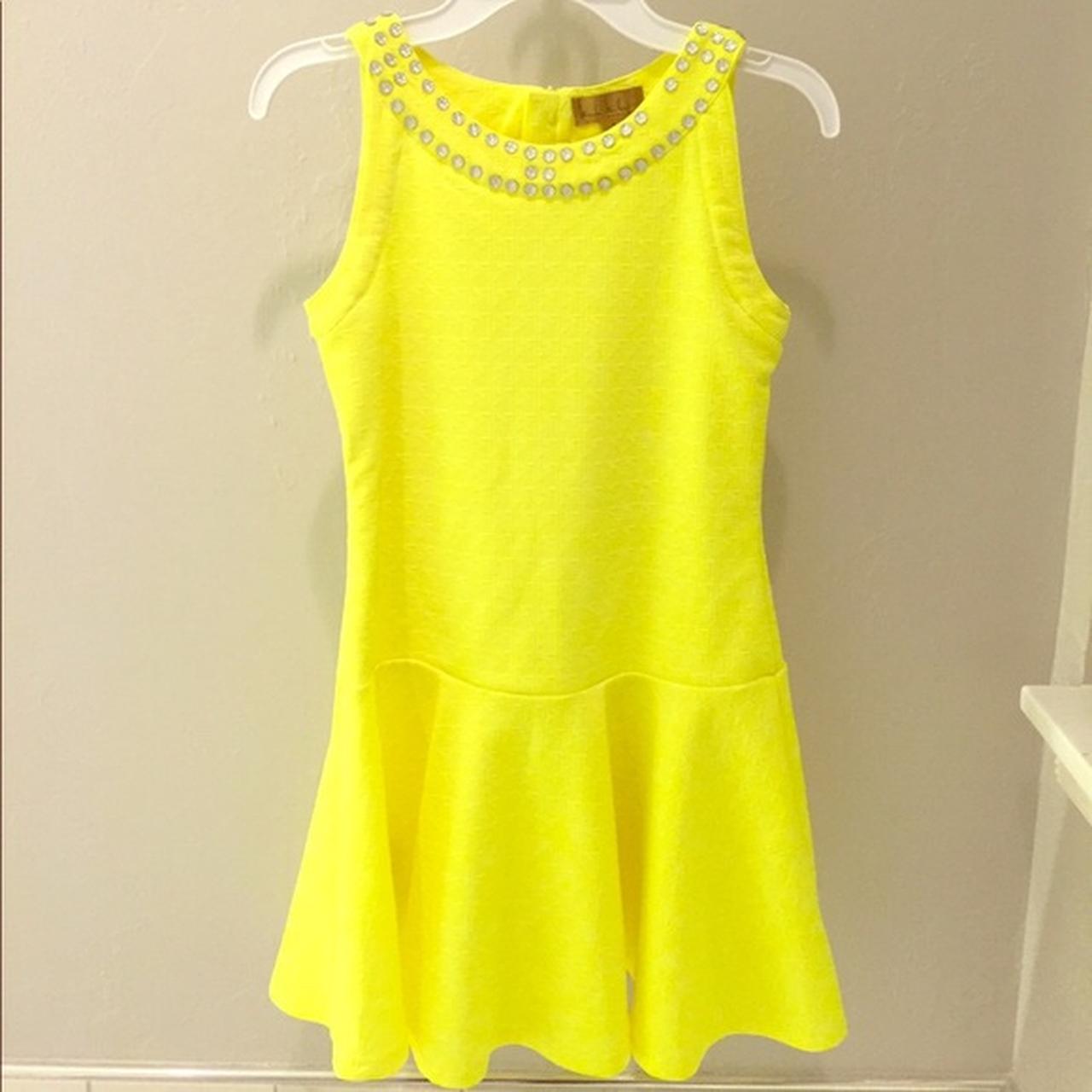 neon yellow fancy dress. fits a women’s XSS. great... Depop