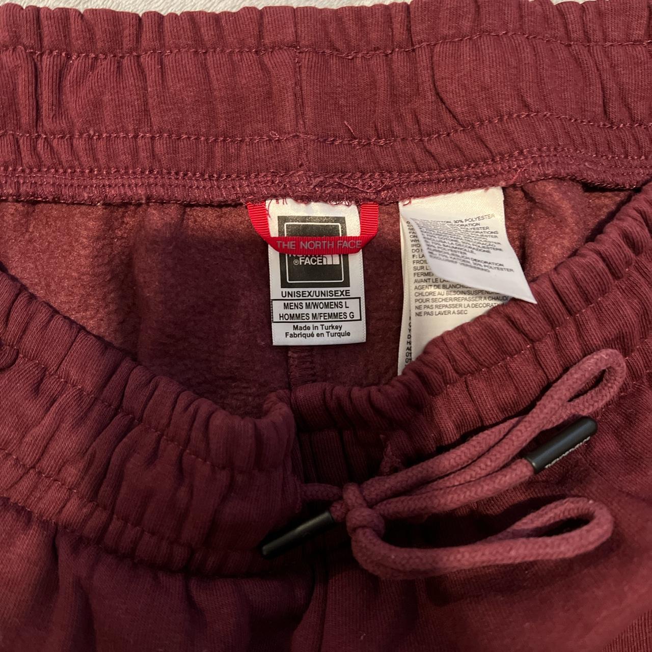 Red north clearance face joggers