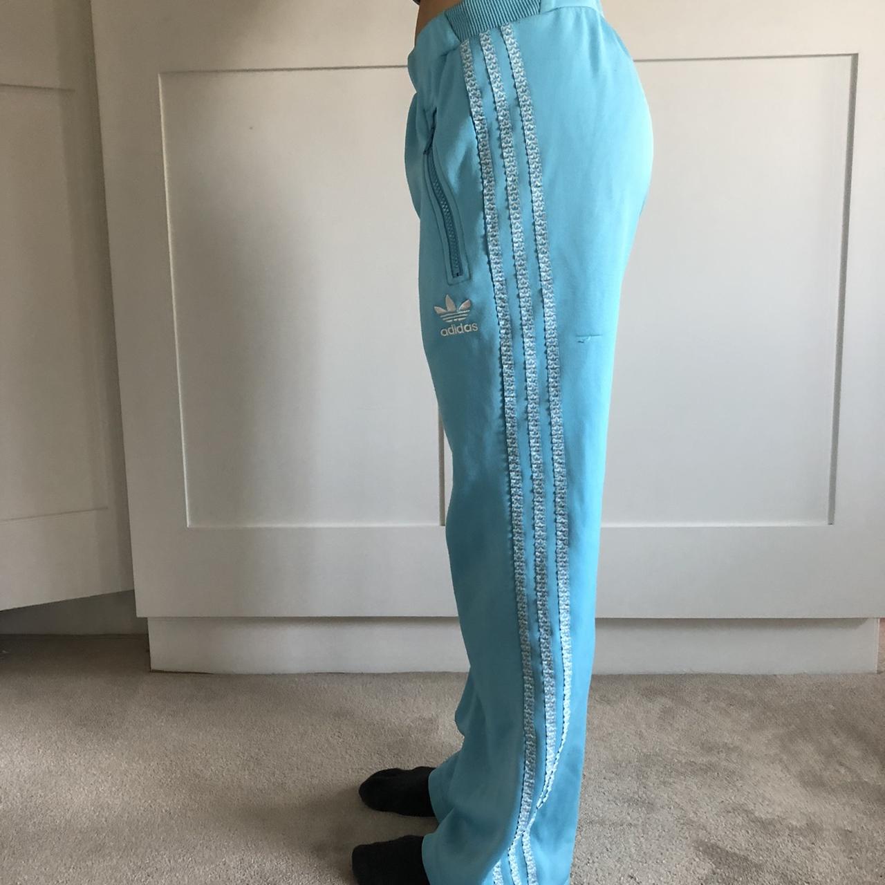 Rare Light blue Adidas tracksuit bottoms. Flared... - Depop