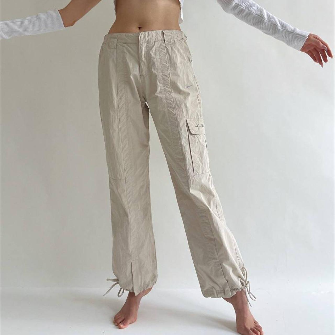 Nike cargo beige low waisted trousers with side... Depop