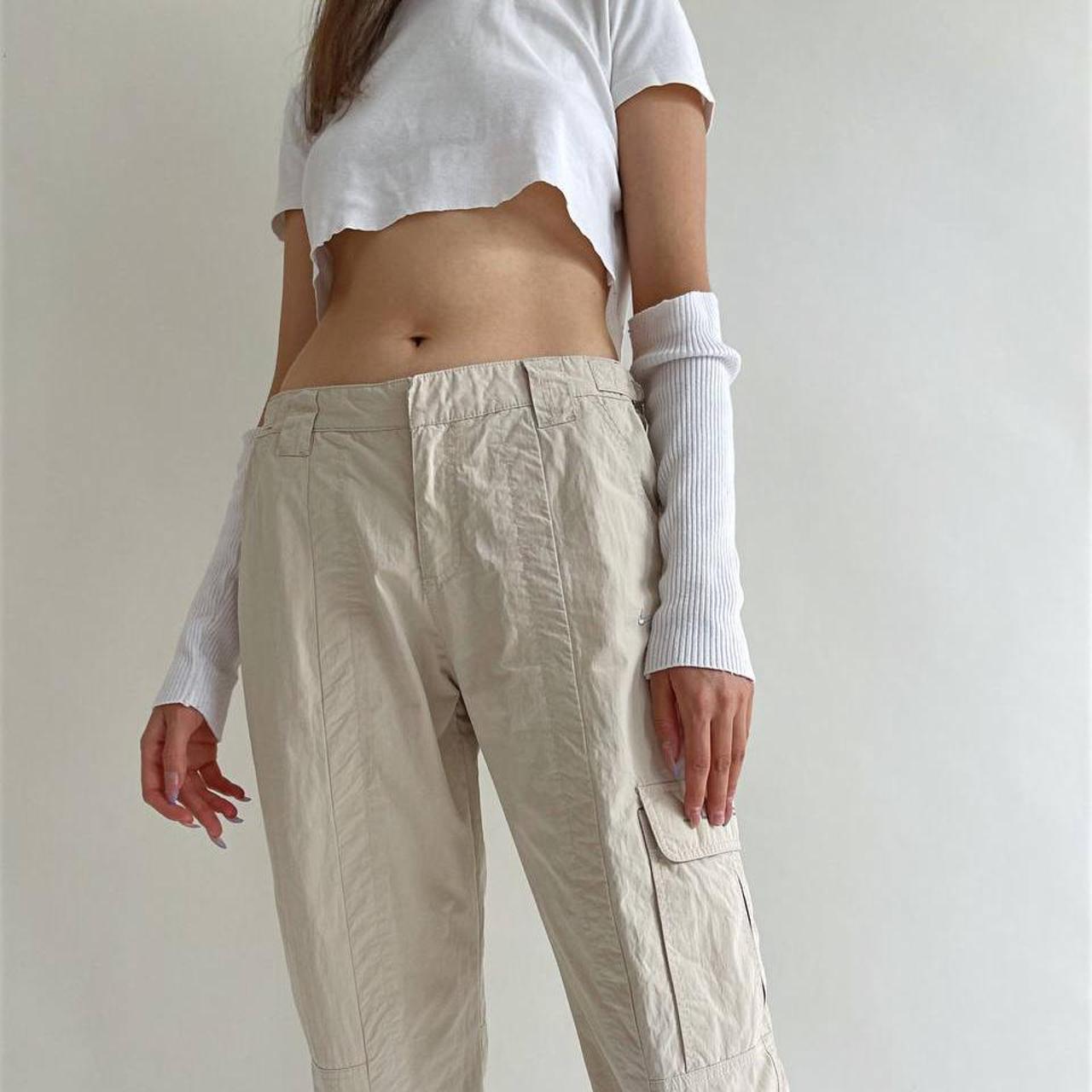 Nike cargo beige low waisted trousers with side... Depop
