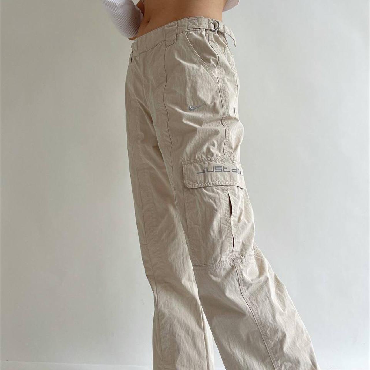 Nike cargo beige low waisted trousers with side... Depop