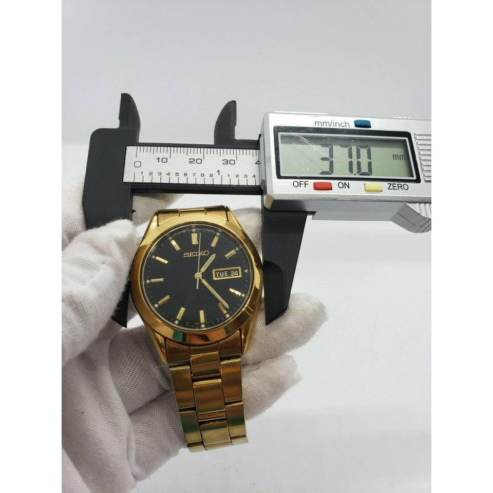 Seiko Men's Gold-Tone Day/Date 7n43-9070 Black Dial... - Depop