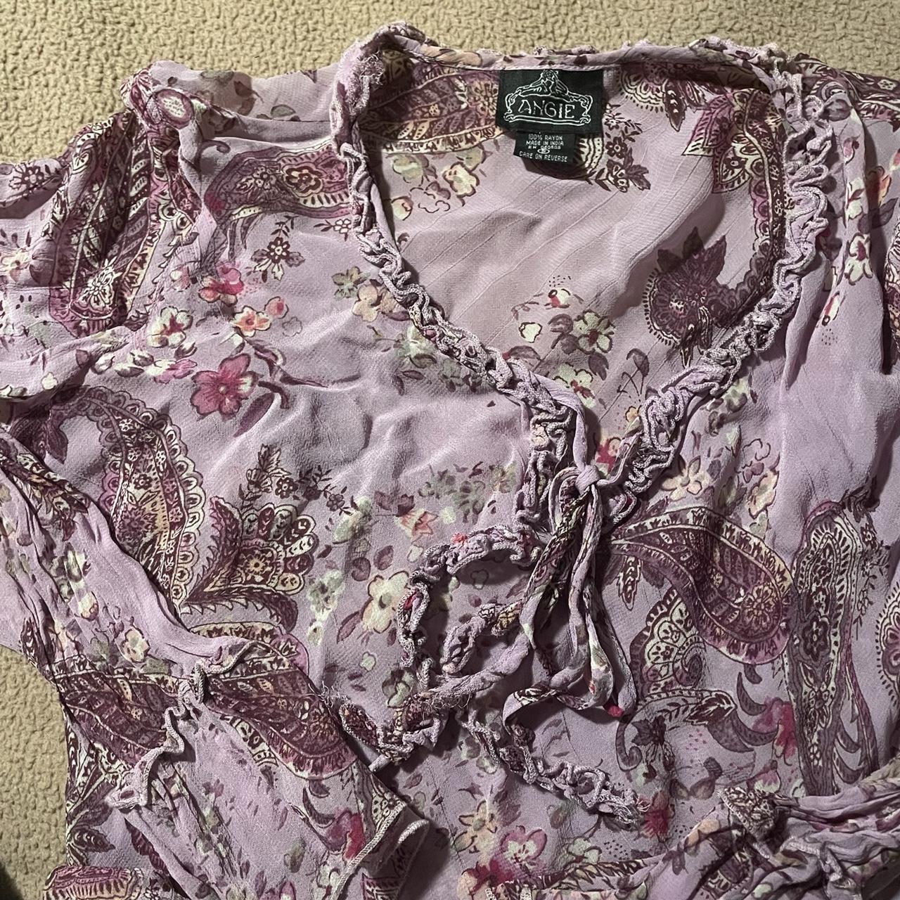 purple floral top. its sheer and ties up in the... - Depop