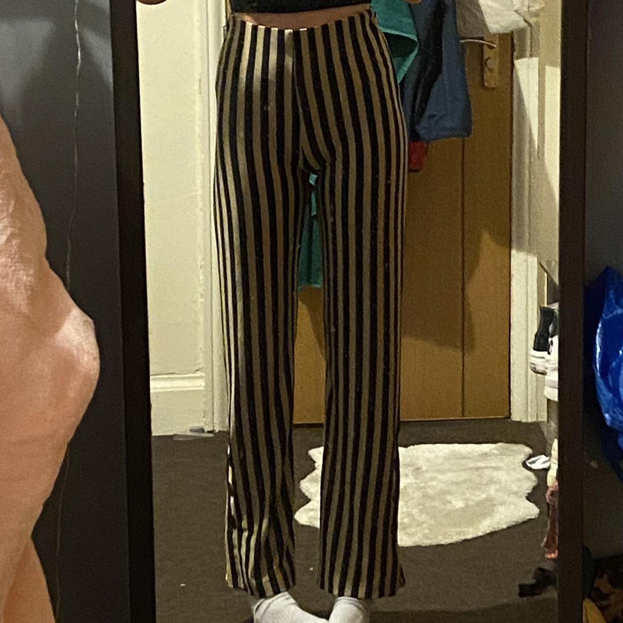 Black and store gold striped pants