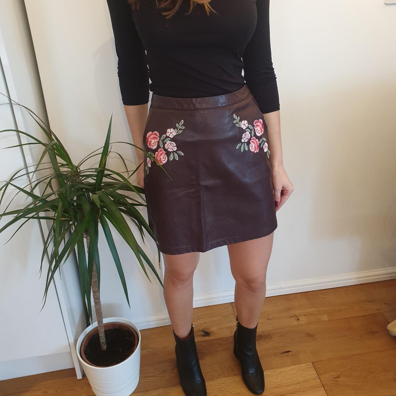 Fake leather skirt with embroidery detail on the...