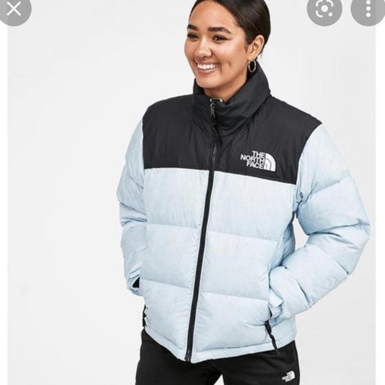 light blue north face puffer jacket