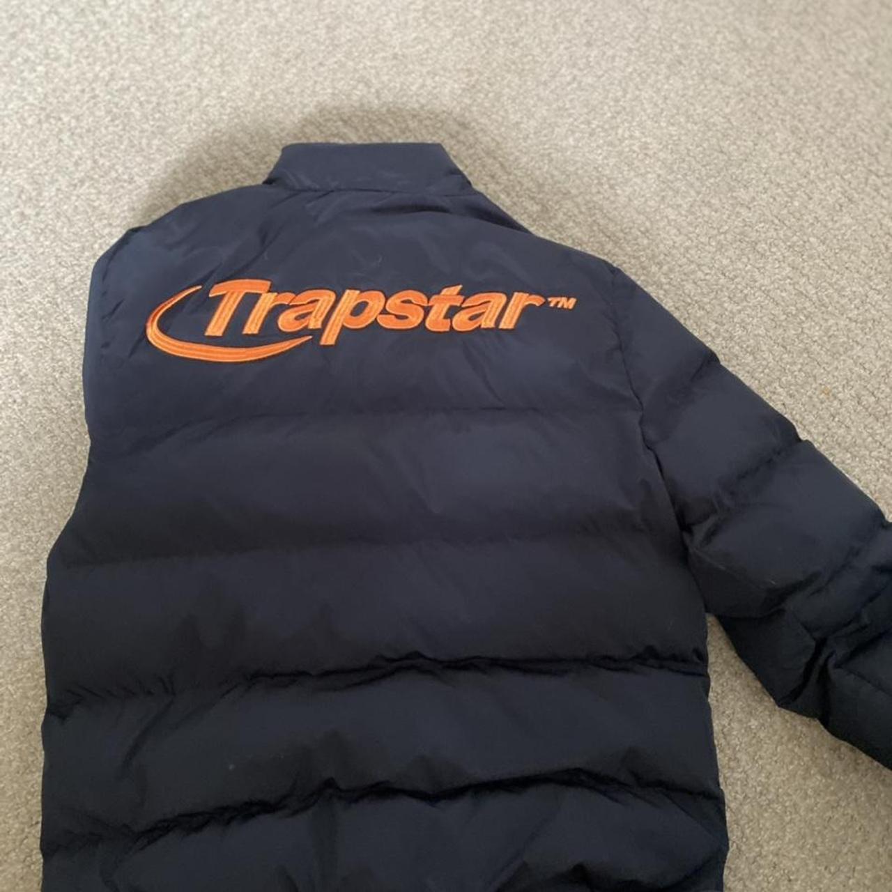 Medium black trap star jacket with orange logo on... Depop