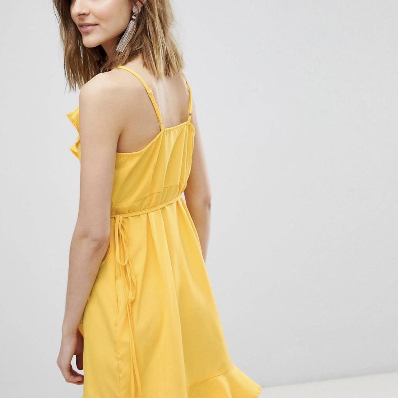 Vero moda wrap ruffle mini dress in yellow! Bought... Depop