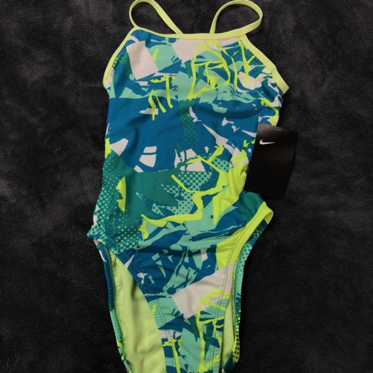 BRAND NEW nike swim suit!! Size 26! Bright color... - Depop