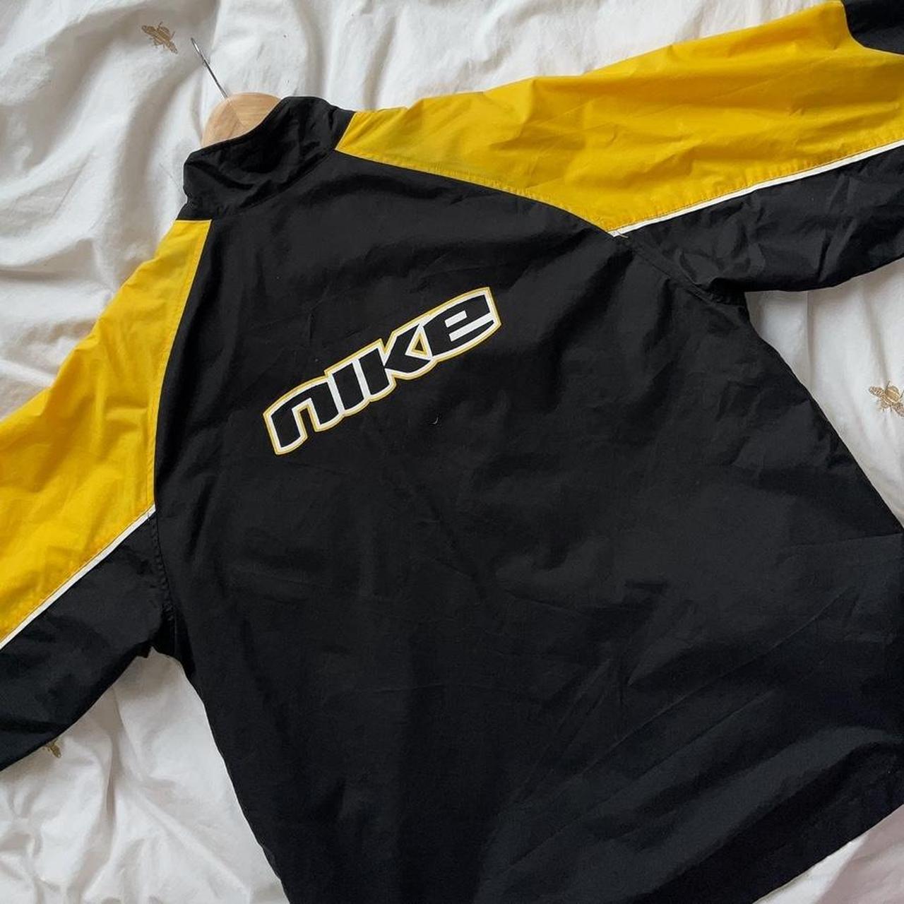 black and yellow nike windbreaker