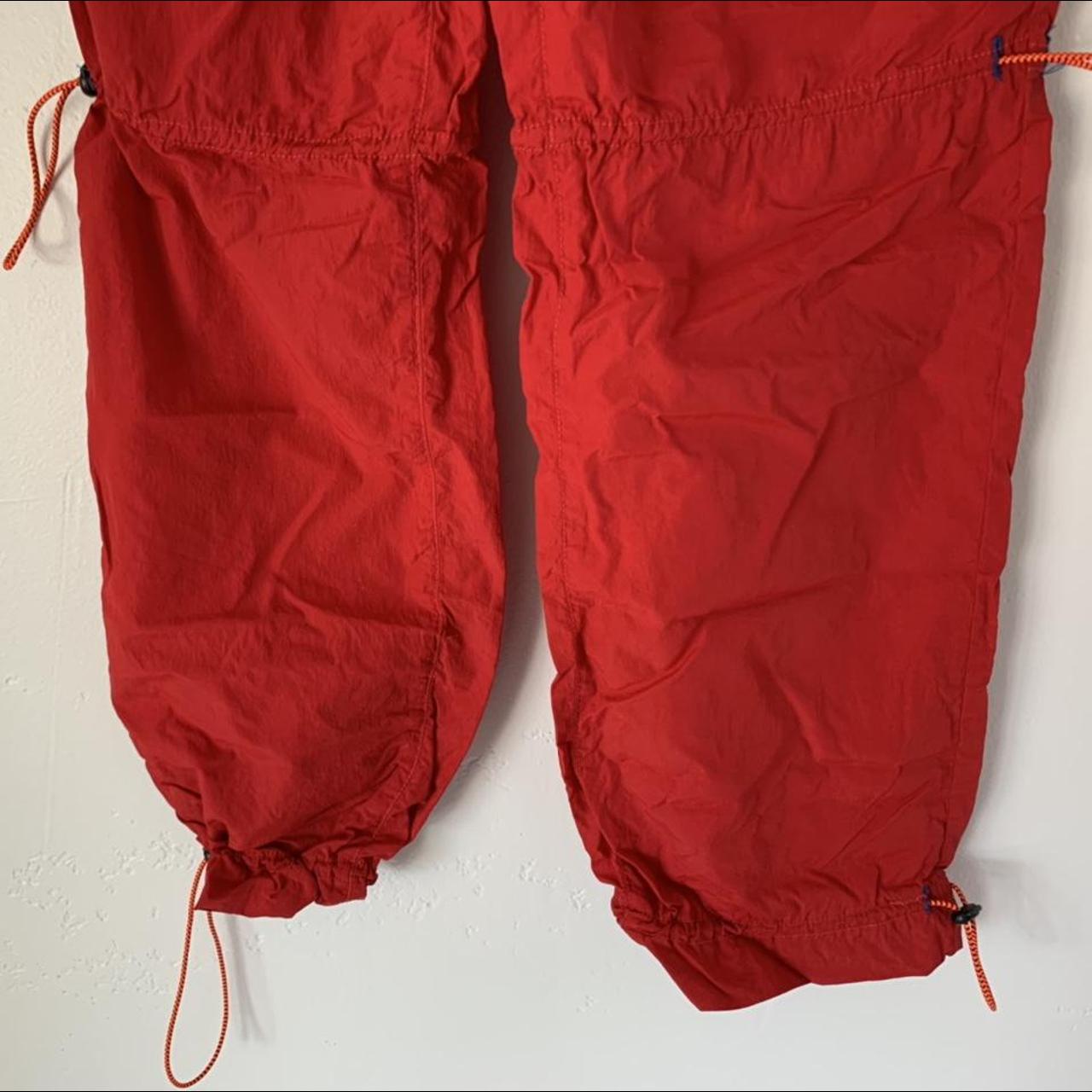 Urban Outfitters Red Joggers made out of wind... Depop