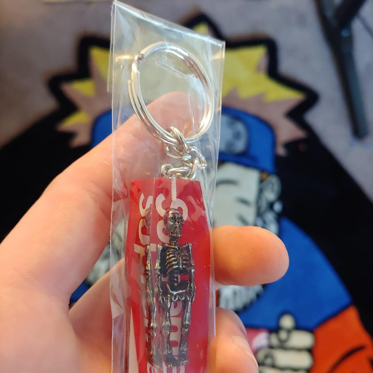 Supreme skeleton keychain sales red