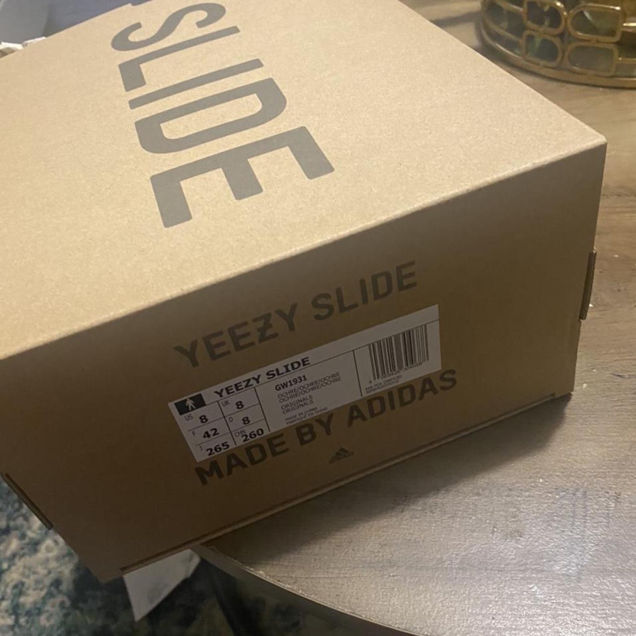 Brand new Yeezy slide never worn , comes with box... - Depop