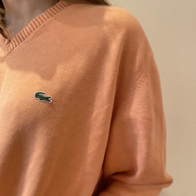 Lacoste orange round neck knit jumper. Small stain Depop