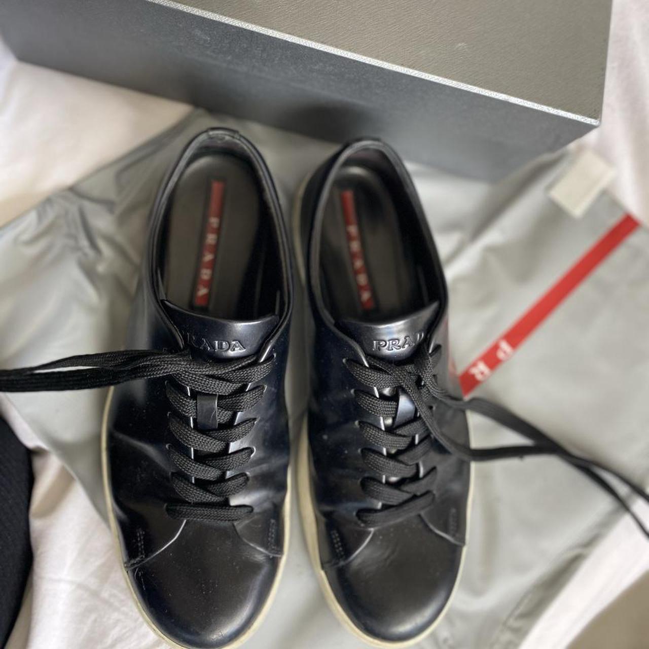 black shiny prada trainers