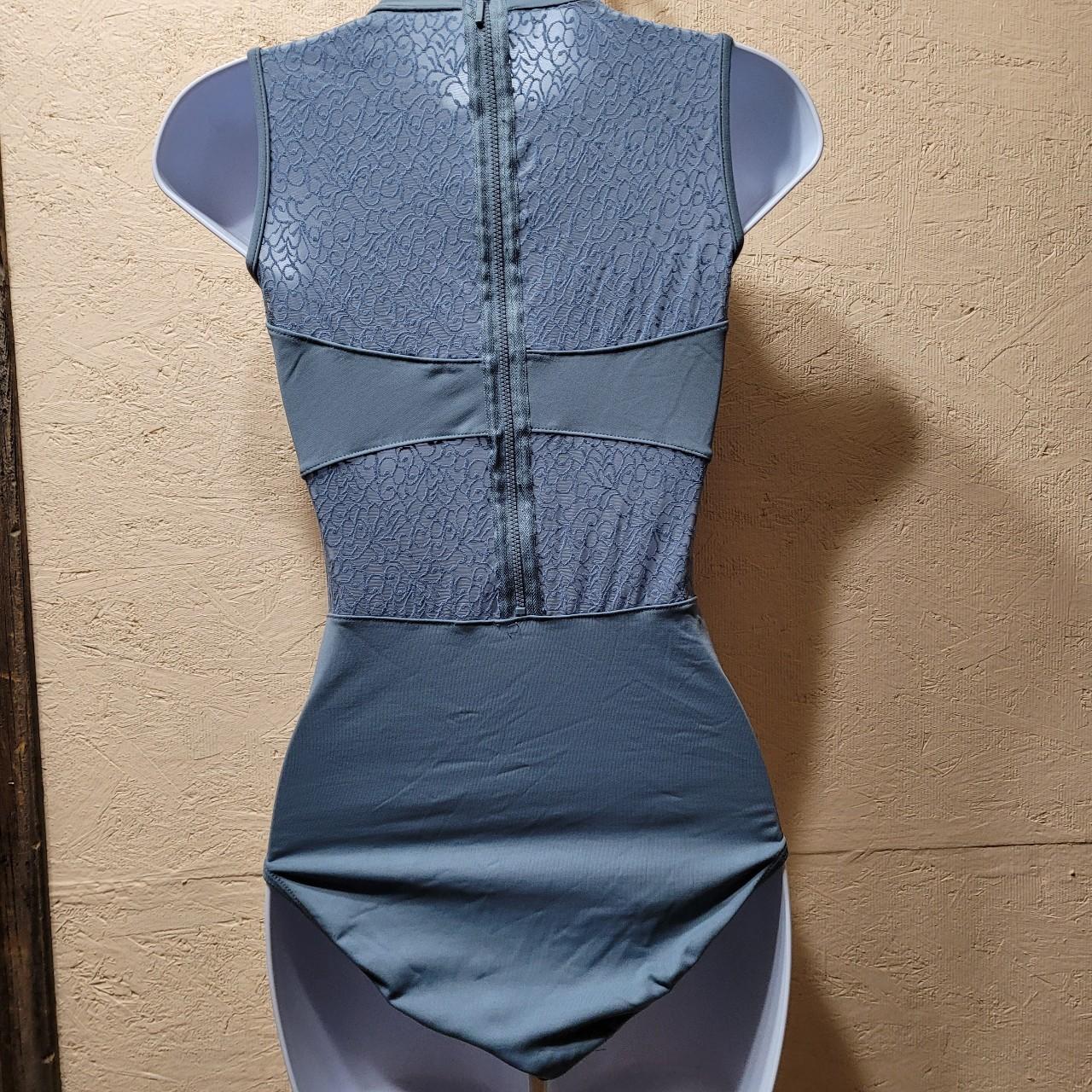 Gently used unbranded lace cut out bodysuit.... Depop