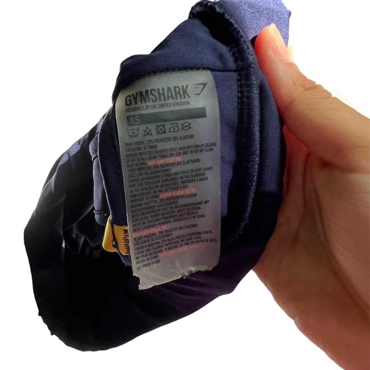 super cute gymshark navy and gold sports bra. loving... Depop