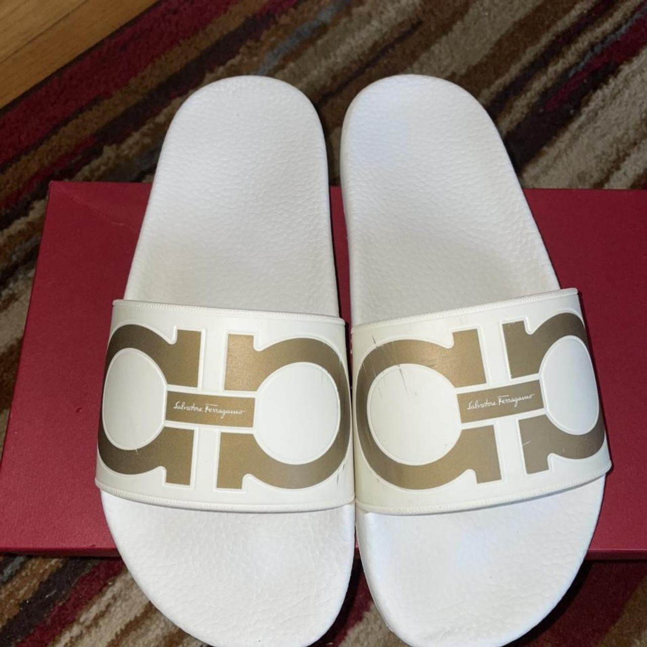 white and gold ferragamo slides