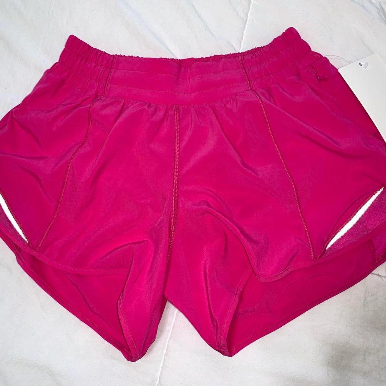 Lululemon sonic pink hotty hot shorts Size 4 Message - Depop