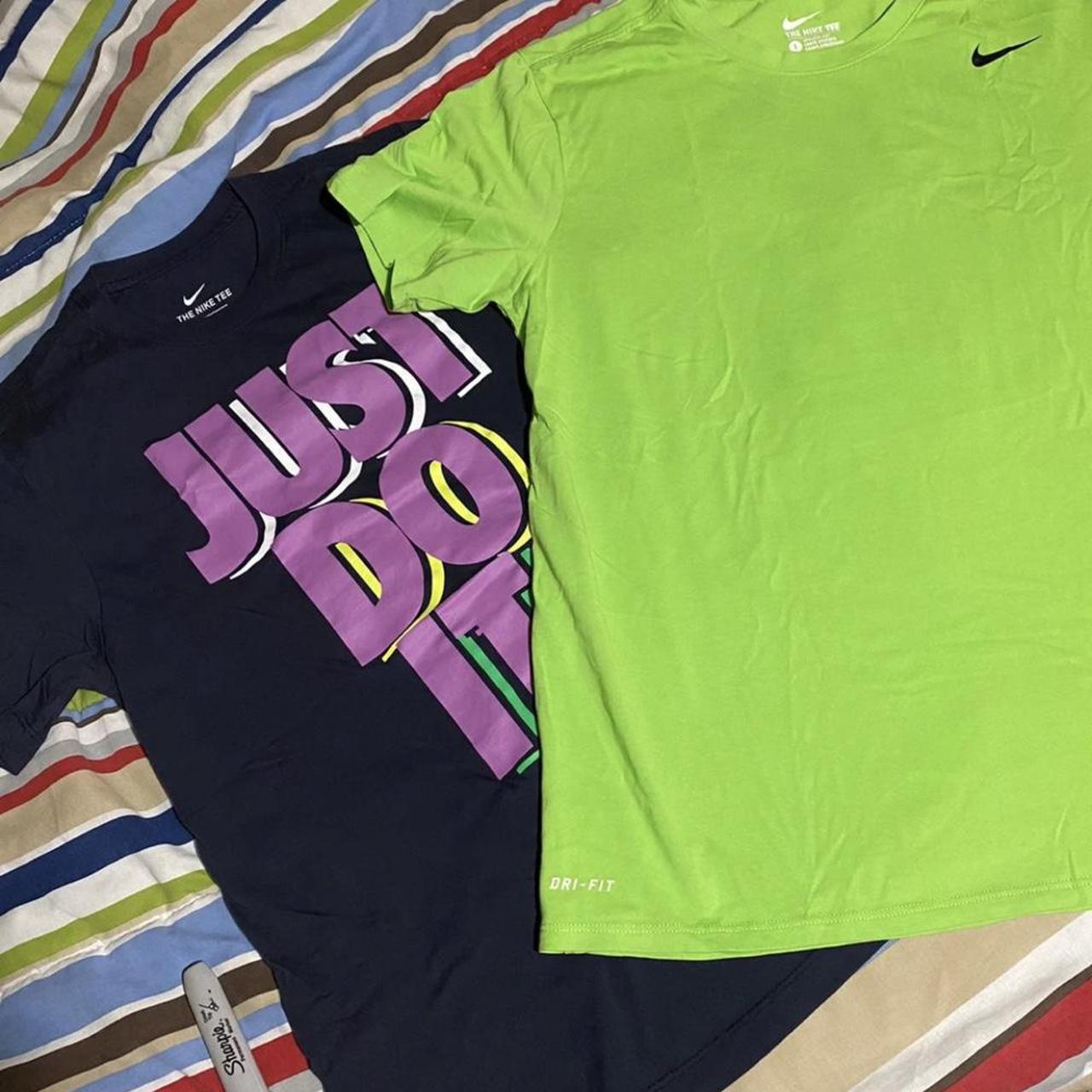 navy blue and neon green nike shirt