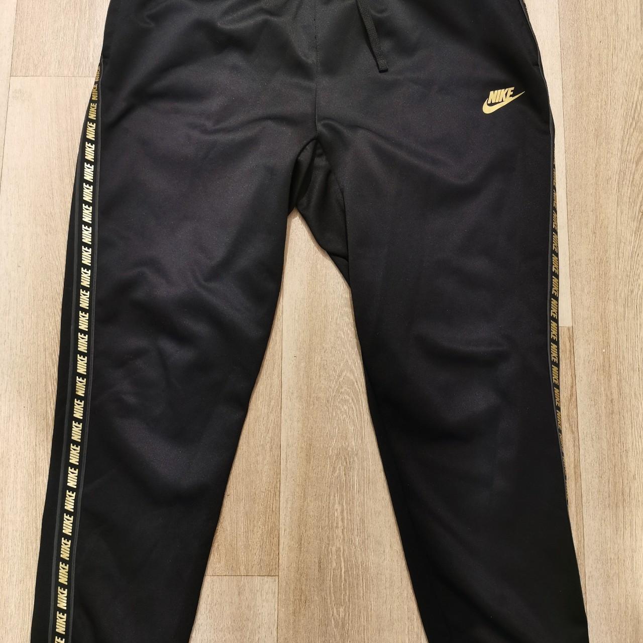 Black and gold nike joggers best sale