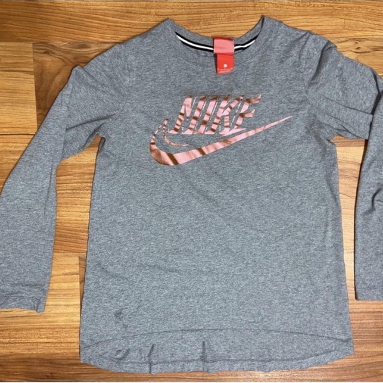 pink and gold nike shirt