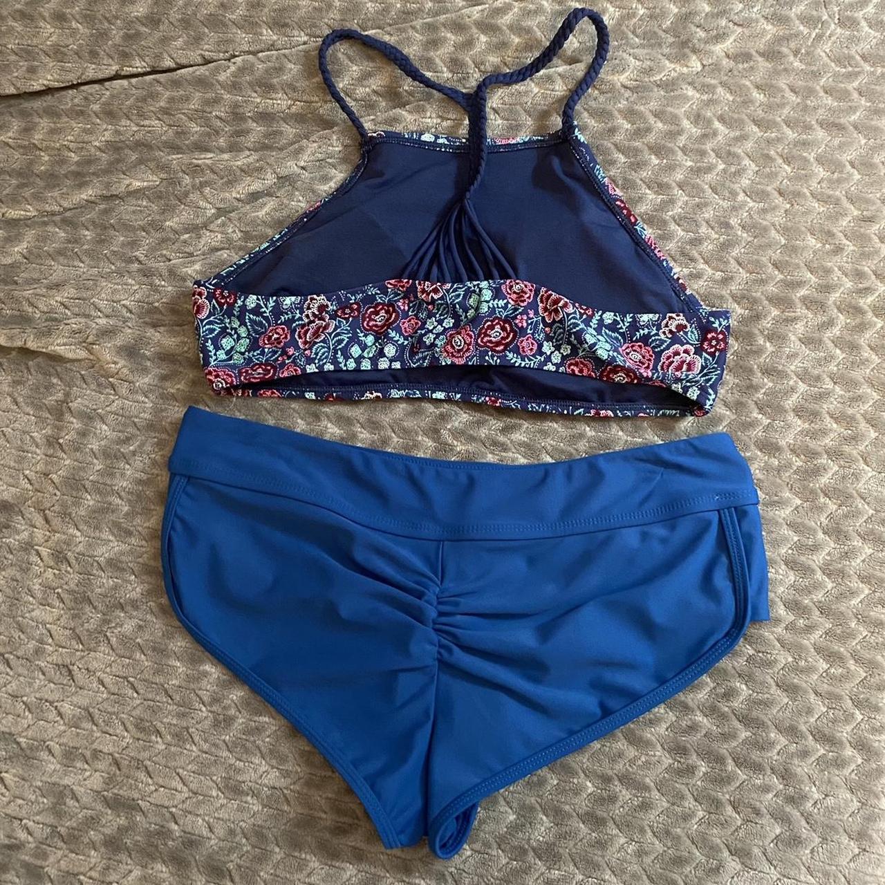 Blue and pink bikini. Bottoms are medium, size tag... - Depop