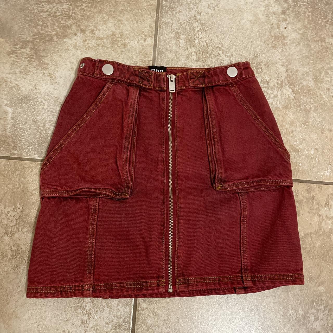 Burgundy cargo style skirt with full zip front. This... Depop
