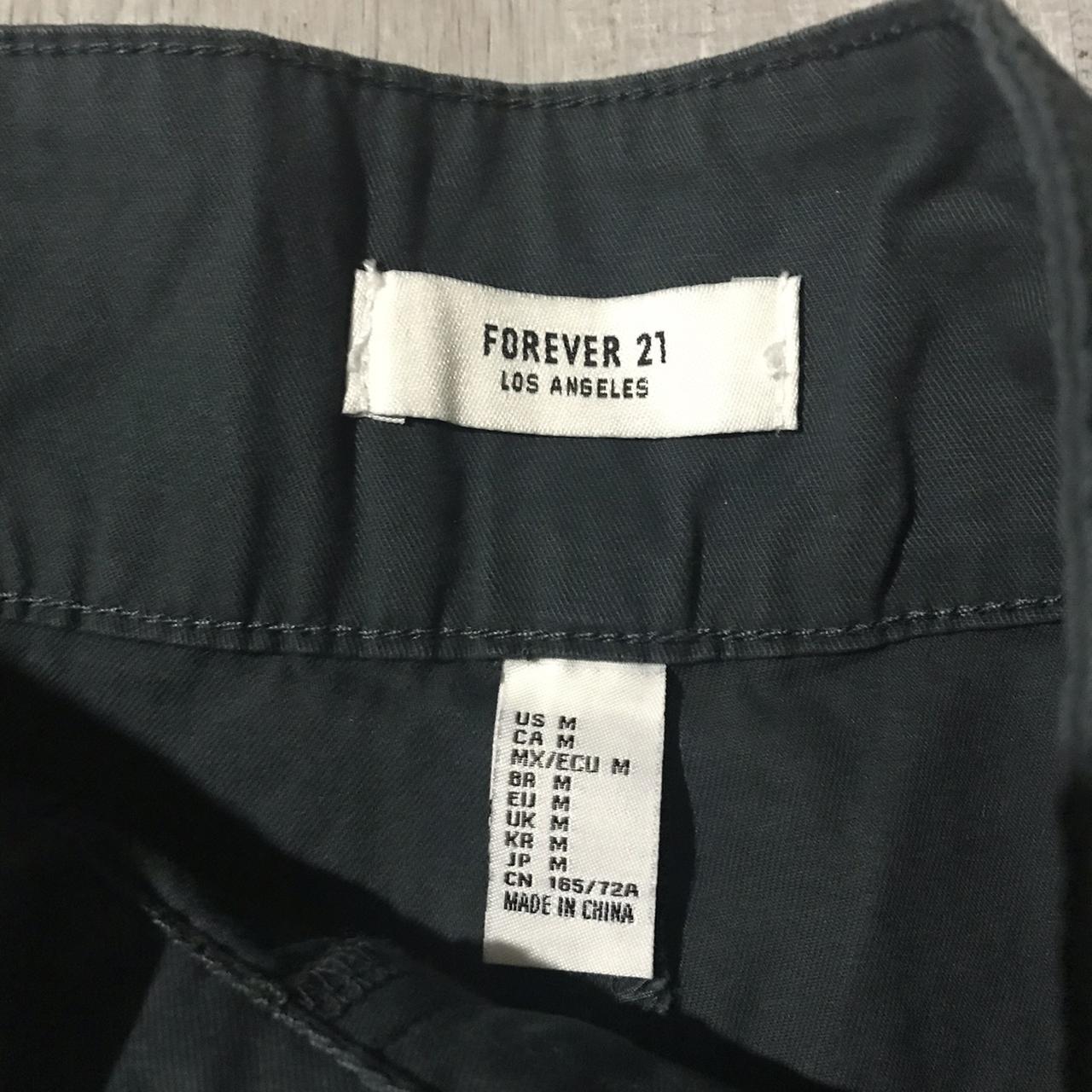 Forever 21 evergreen cargo pants with buckle detail... Depop