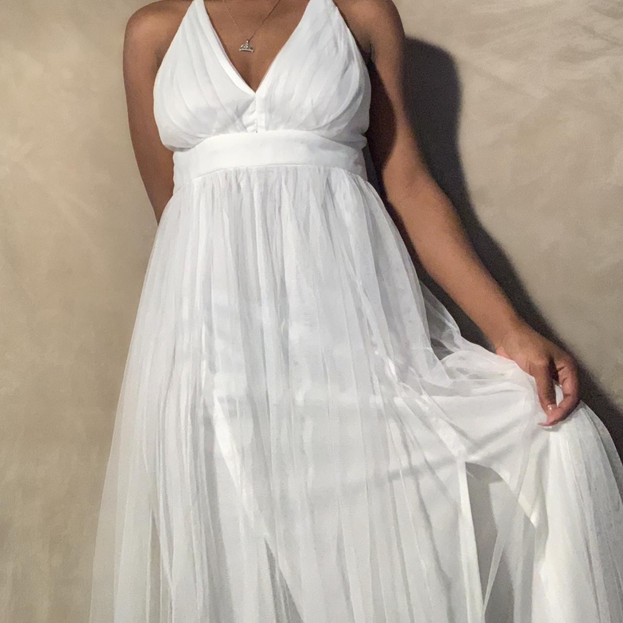 Cute, long maxi dress. Has two long slits in the... Depop