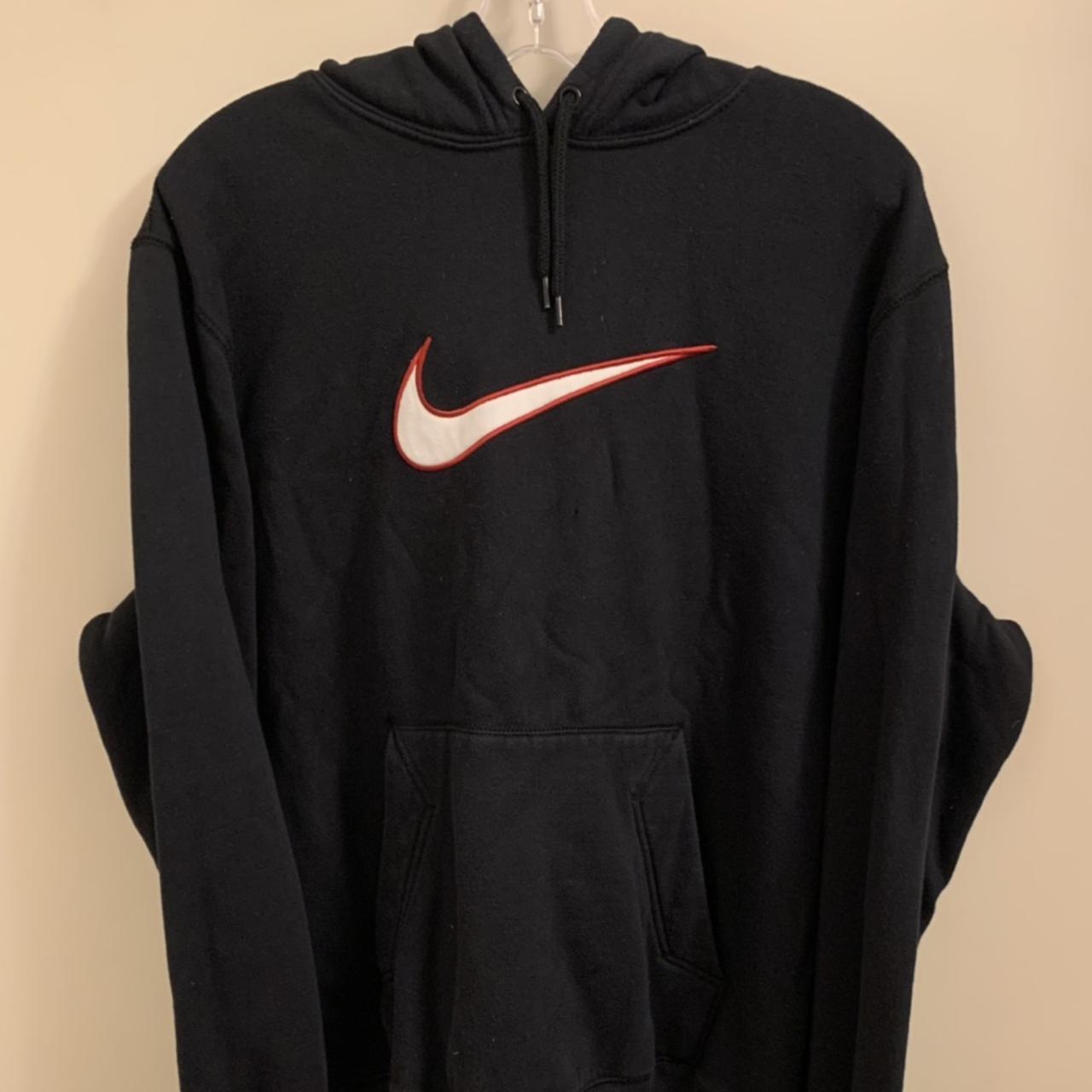 black nike sweatshirt with red swoosh