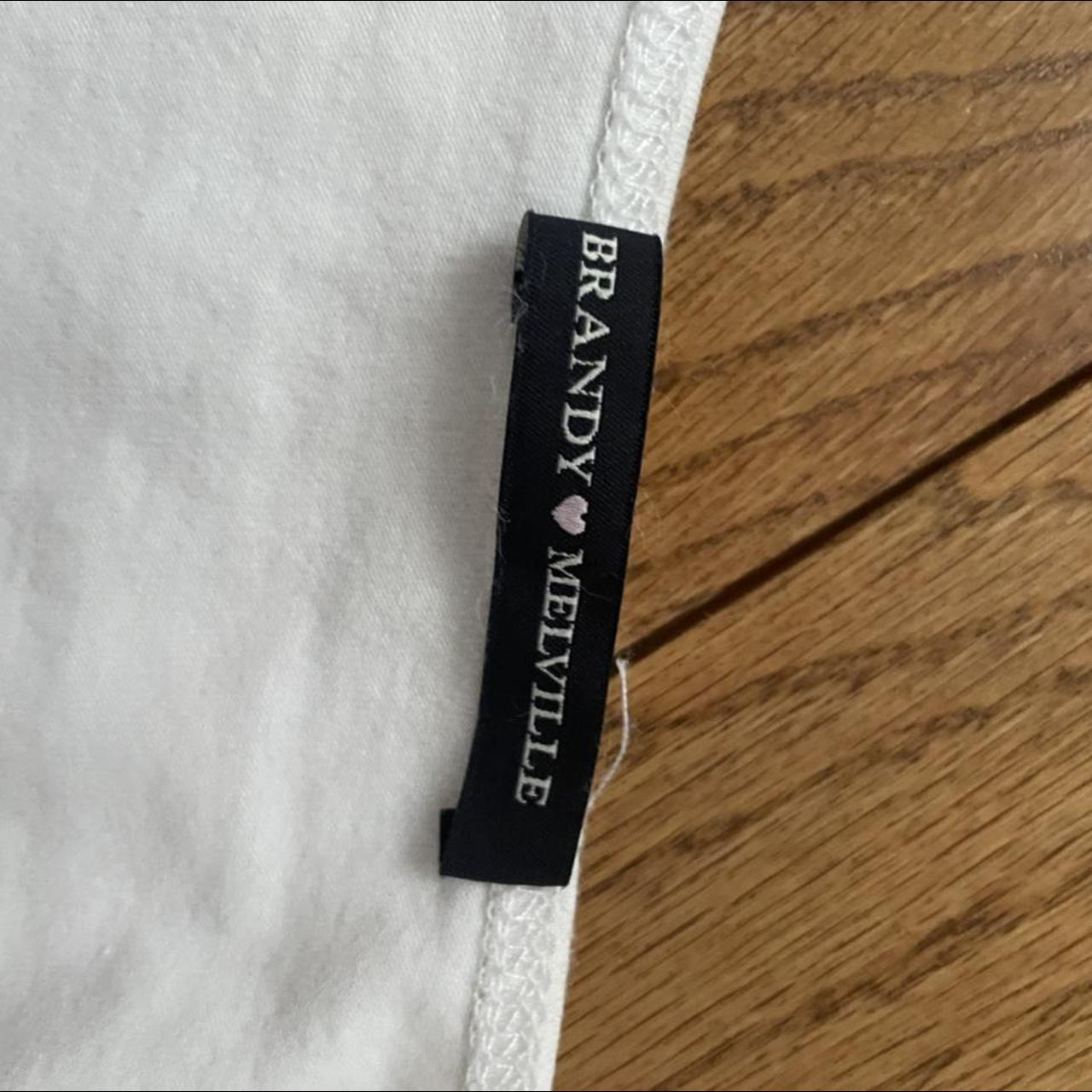 brandy melville white wrap shirt. cropped, ties in... Depop