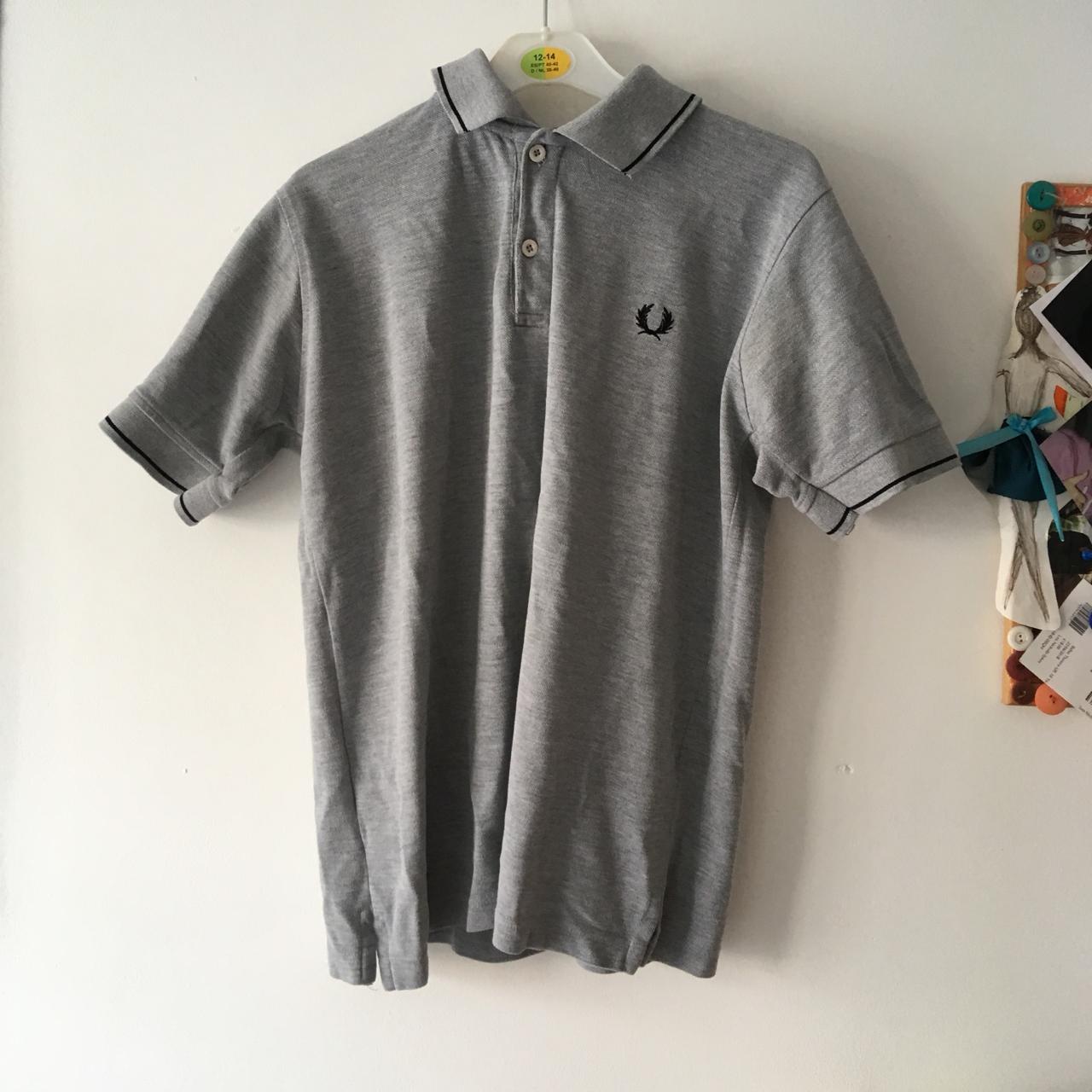 Grey Fred Perry polo top. Black trim around the... - Depop