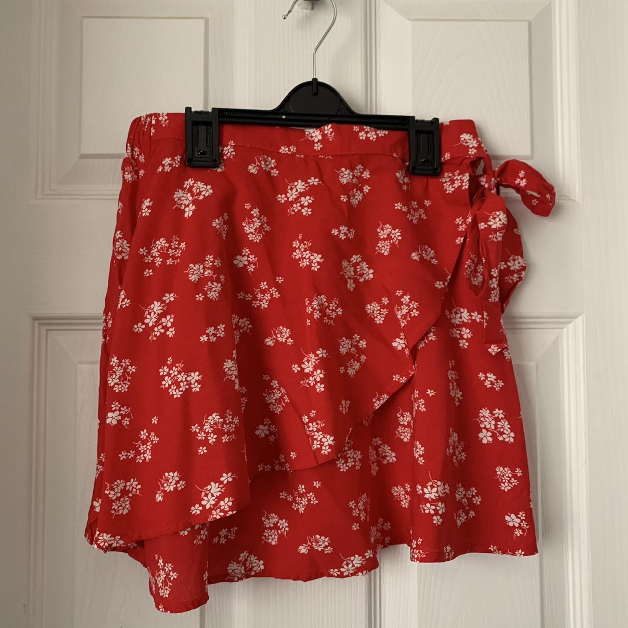 Good condition wraparound mini skirt. Floral print... Depop