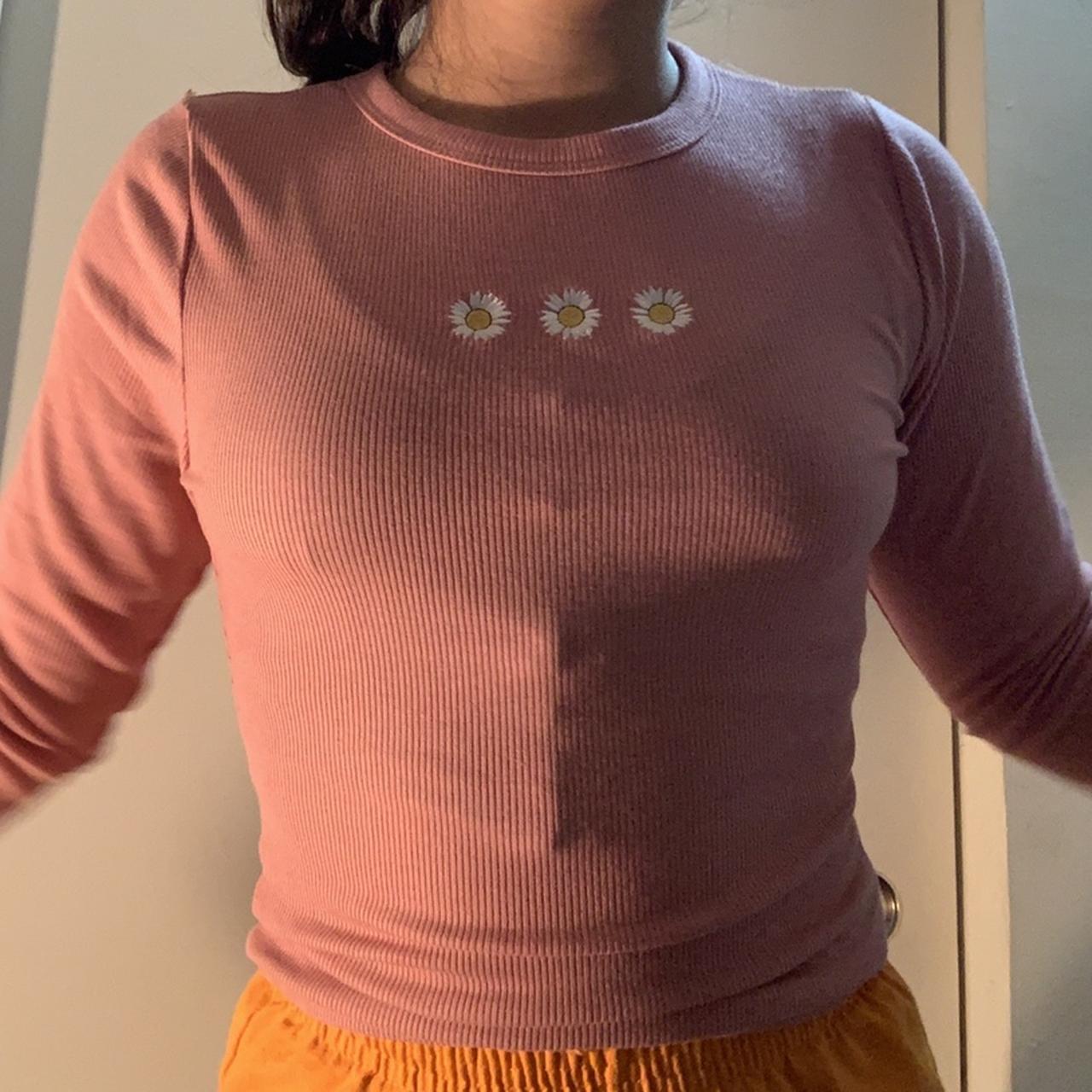 Pink rigid long sleeve top with white daisy at the... - Depop