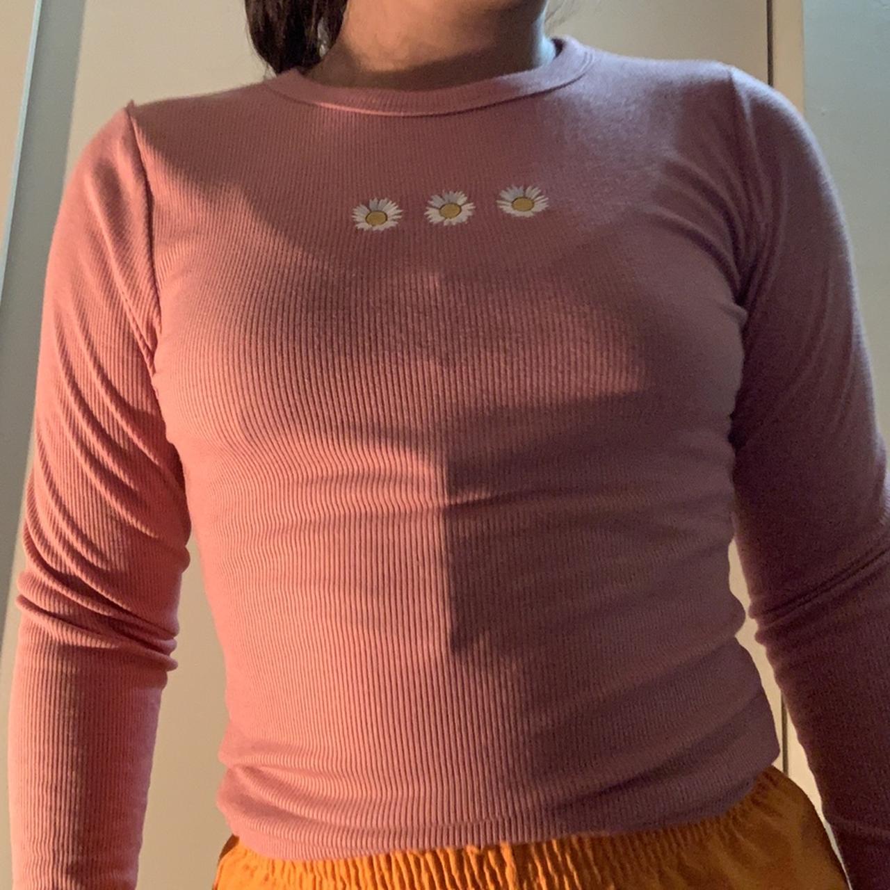 Pink rigid long sleeve top with white daisy at the... - Depop