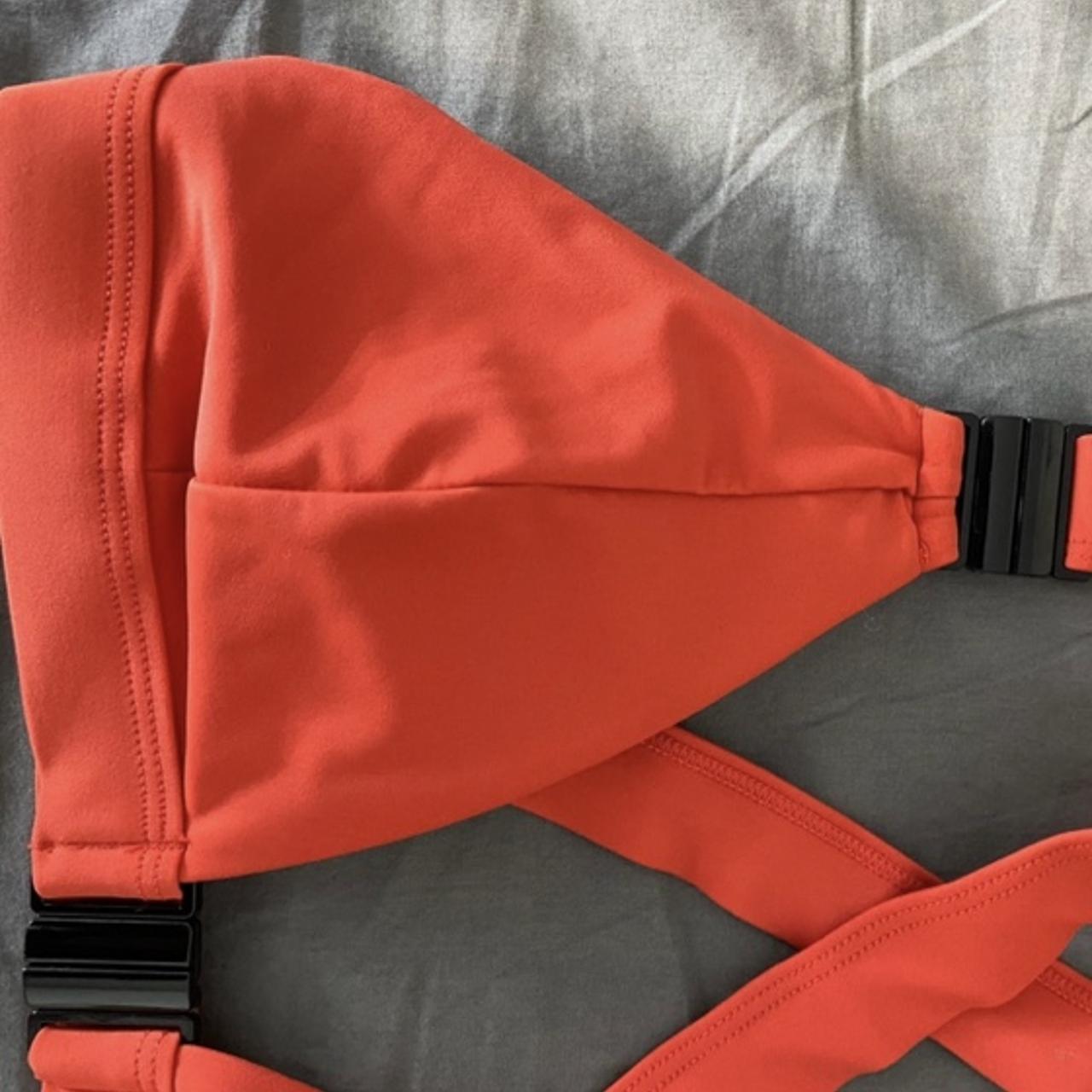 Target orange bikini top. Details are black buckles... Depop