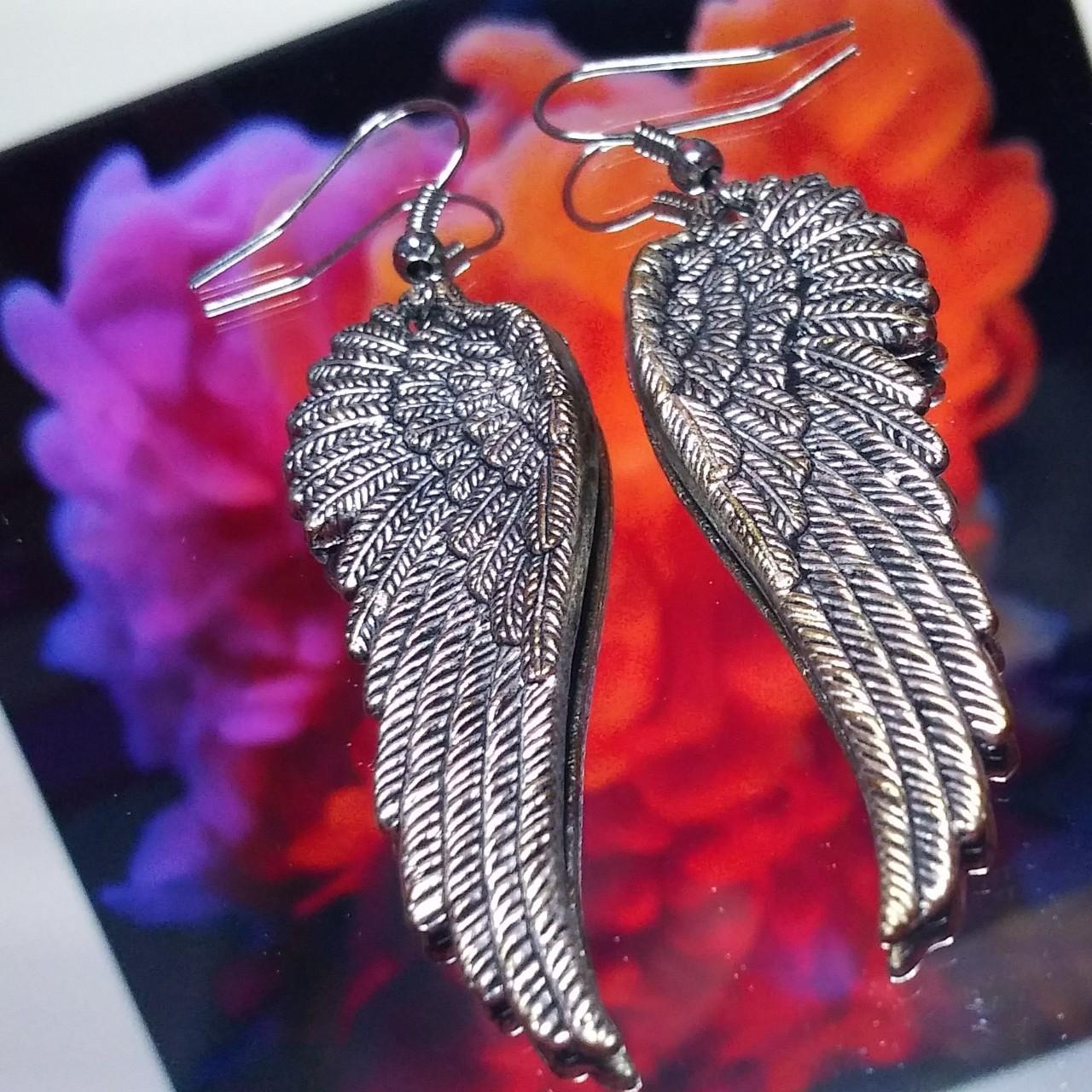 Adorable y2k wing earrings Lmk if you have any... - Depop